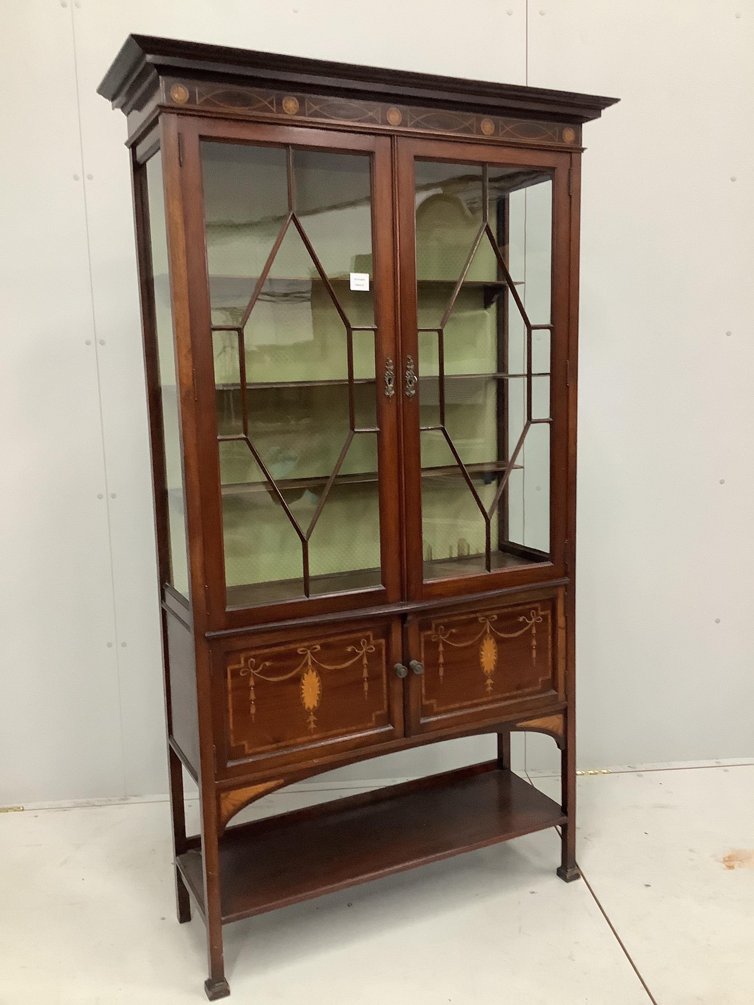 An Edwardian marquetry inlaid mahogany display cabinet, width 103cm, depth 36cm, height 181cm